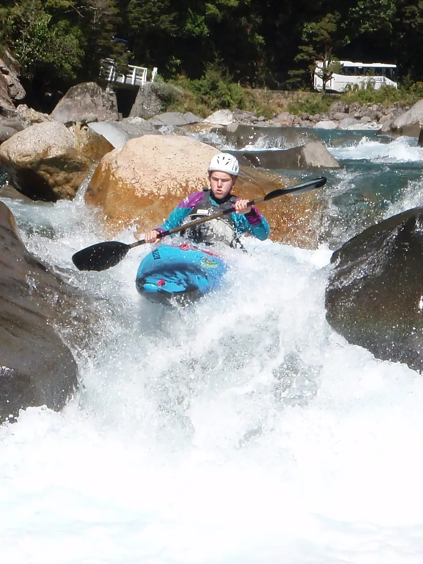 Kayaker on Hollyford river NZ