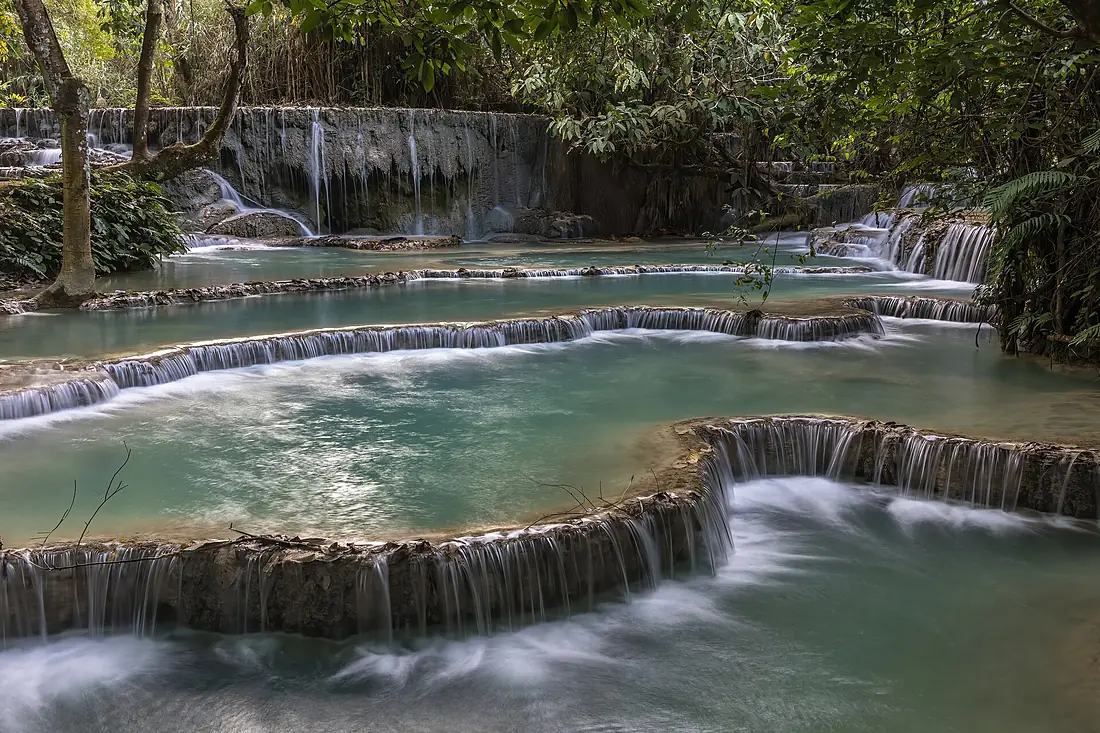 Kuang Si Falls and its emerald tiered water pools in Luang Prabang province Laos