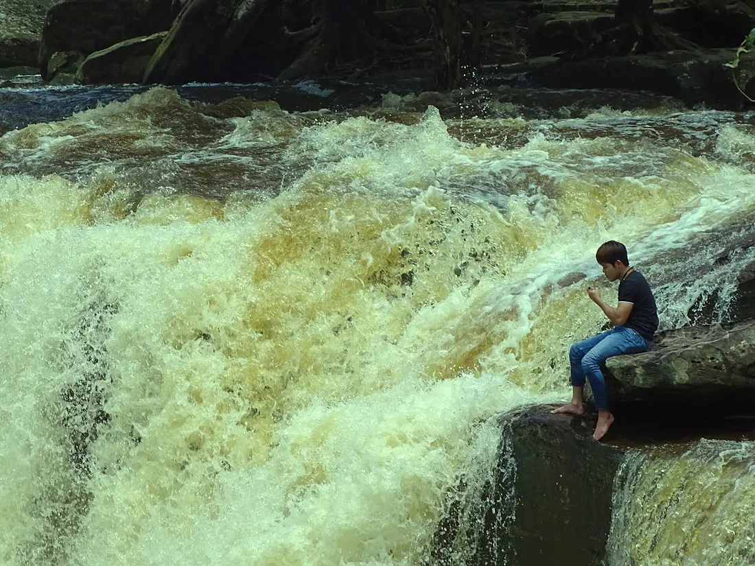 Boy Seated by Popokvil Waterfall - Bokor Hill Station - Near Kampot - Cambodia (48529023987)